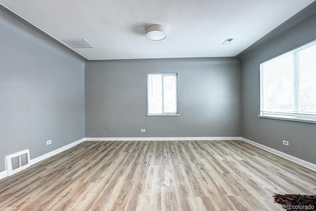 361 N Raleigh St, Denver, CO 80219 - unfurnished room with healthy amount of natural light and wood finished floors