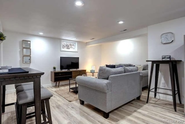 361 N Raleigh St, Denver, CO 80219 - living room featuring light wood-style floors and recessed lighting