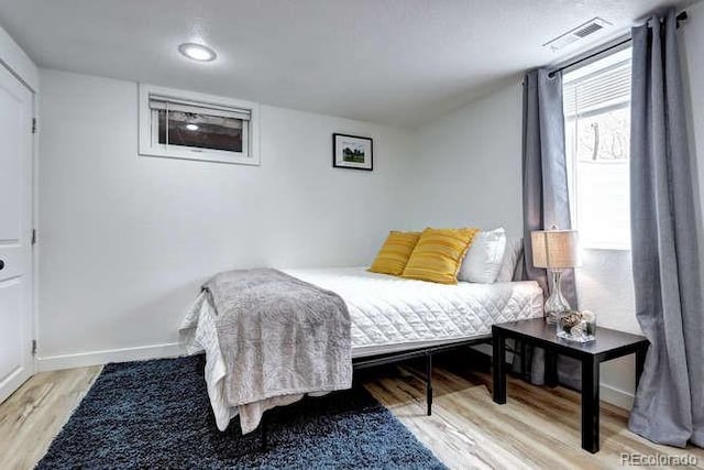 361 N Raleigh St, Denver, CO 80219 - bedroom featuring light wood-type flooring and baseboards