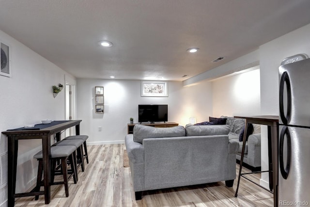 361 N Raleigh St, Denver, CO 80219 - living area with light wood-type flooring and recessed lighting