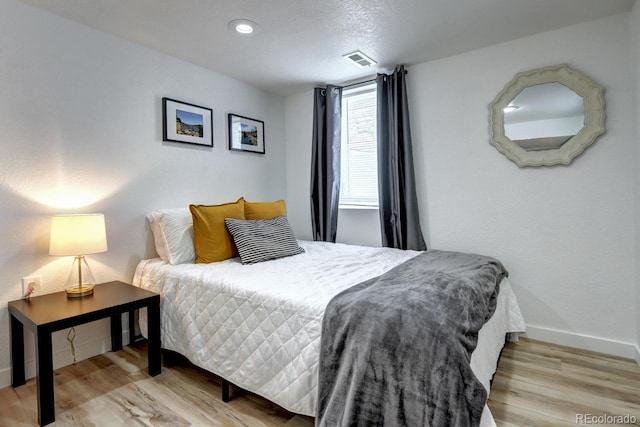 361 N Raleigh St, Denver, CO 80219 - bedroom with baseboards and wood finished floors