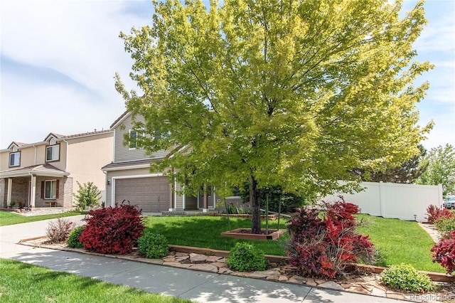 5400 Perth St, Denver, CO 80249 - obstructed view of property with an attached garage and driveway