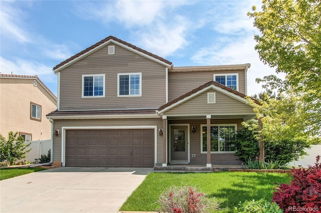 5400 Perth St, Denver, CO 80249 - traditional-style home with covered porch, an attached garage, concrete driveway, and a tiled roof