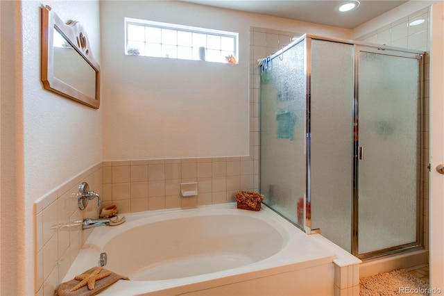 5400 Perth St, Denver, CO 80249 - bathroom featuring a shower stall, a bath, and recessed lighting