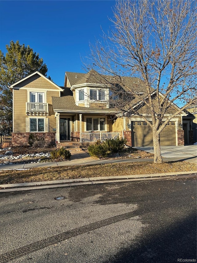 view of front of property featuring a garage and covered porch