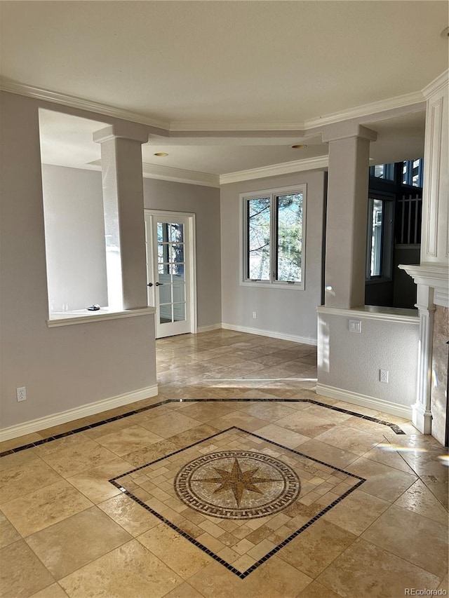 unfurnished room with ornamental molding and ornate columns