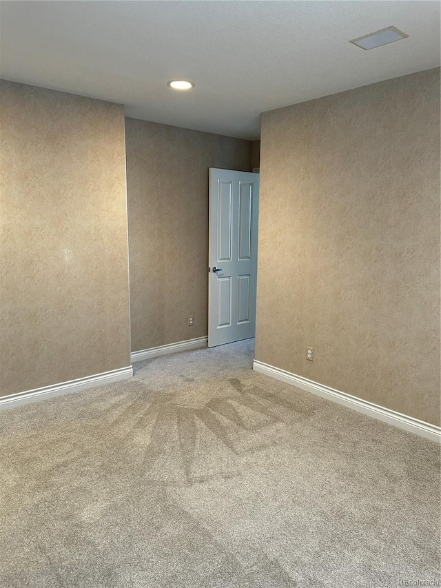 view of carpeted spare room