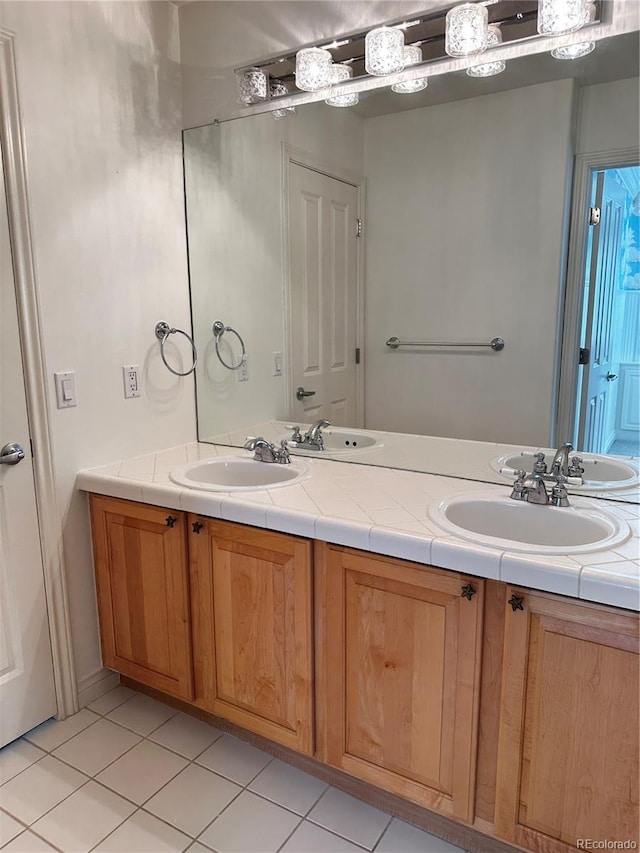 bathroom with vanity and tile patterned flooring