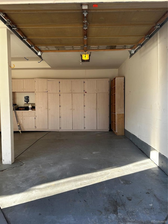 garage featuring a garage door opener