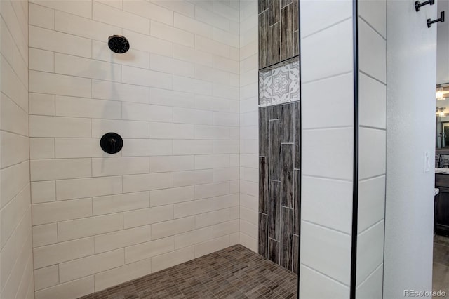 full bathroom featuring tiled shower