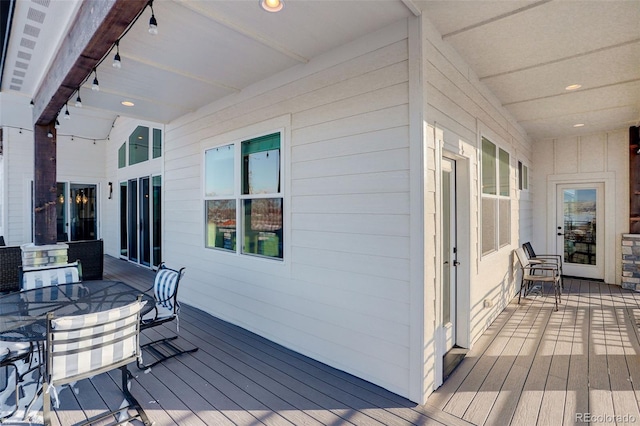 wooden deck featuring outdoor dining space