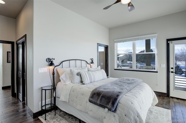 bedroom with baseboards, a ceiling fan, and dark wood-style flooring