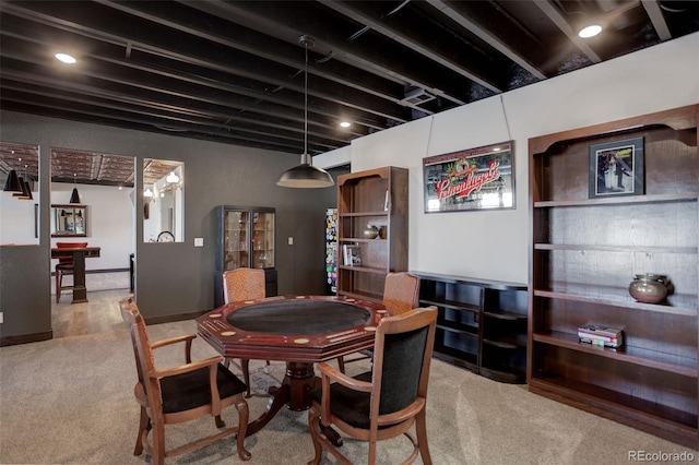 dining space with light colored carpet