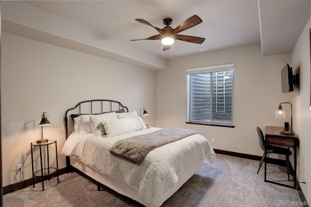 carpeted bedroom with a ceiling fan, visible vents, and baseboards