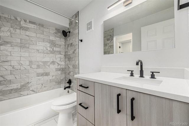 bathroom featuring washtub / shower combination, visible vents, vanity, and toilet