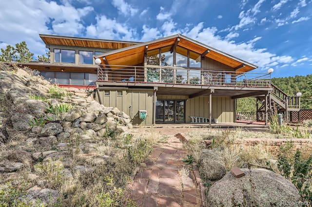 135 Poorman Rd, Boulder, CO 80302 - back of house with stairway and a deck