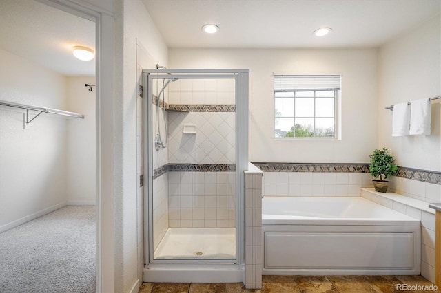 14000 Winding River Ct Unit T3, Broomfield, CO 80023 - bathroom with a garden tub, a stall shower, and recessed lighting