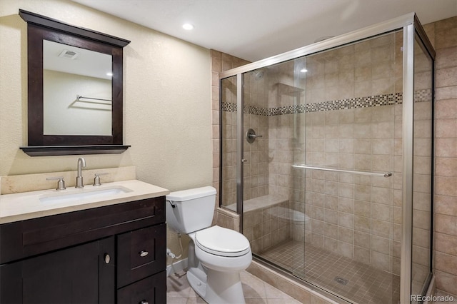 14000 Winding River Ct Unit T3, Broomfield, CO 80023 - full bath with vanity, a stall shower, a textured wall, and tile patterned flooring