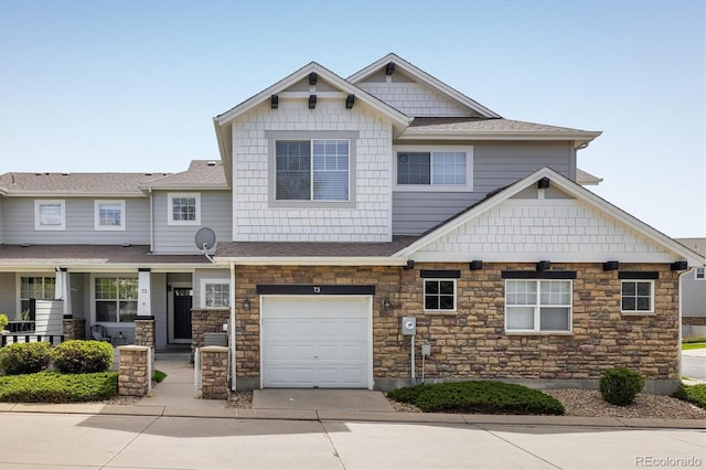 14000 Winding River Ct Unit T3, Broomfield, CO 80023 - craftsman house featuring stone siding, a garage, driveway, a porch, and a shingled roof