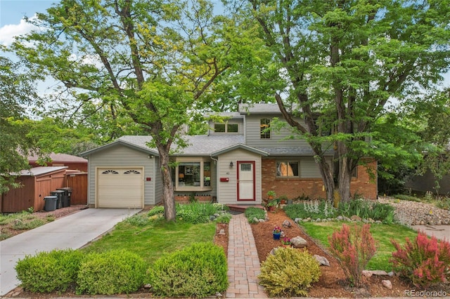 40 S 34th St, Boulder, CO 80305 - view of front of property featuring an attached garage, driveway, brick siding, and a shingled roof