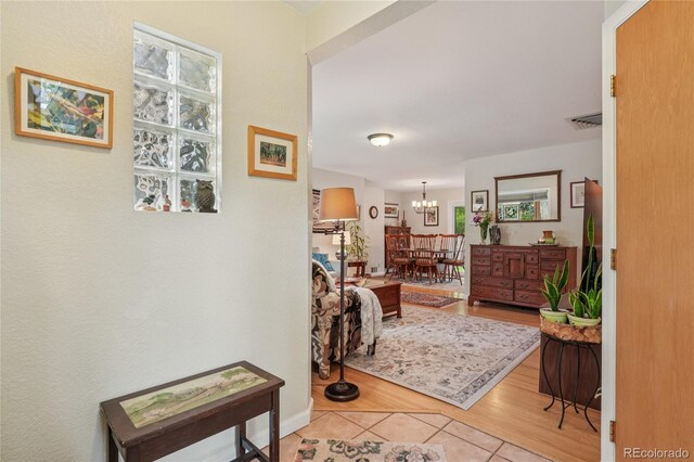 40 S 34th St, Boulder, CO 80305 - hallway with a chandelier and light tile patterned flooring