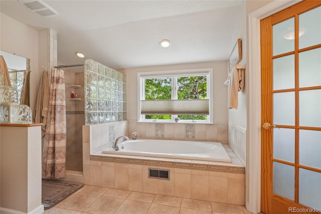 40 S 34th St, Boulder, CO 80305 - bathroom featuring a bath, tiled shower, and tile patterned floors