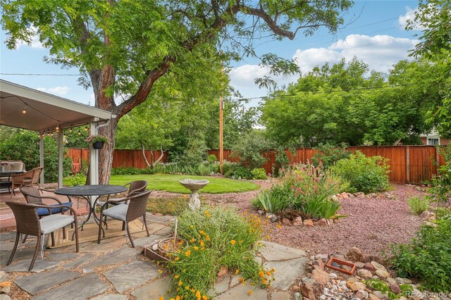 40 S 34th St, Boulder, CO 80305 - fenced backyard with outdoor dining area and a patio area