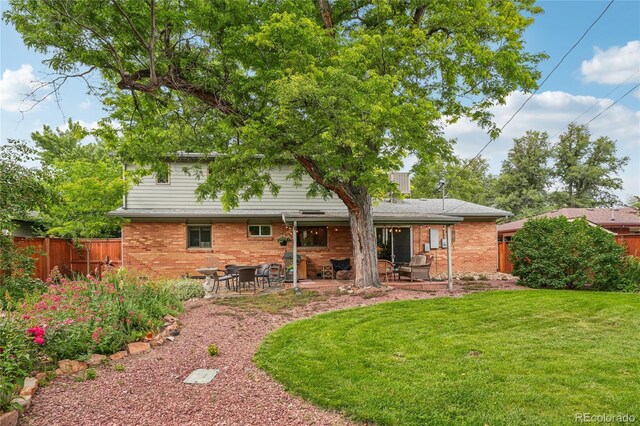 40 S 34th St, Boulder, CO 80305 - back of property with a patio area and brick siding