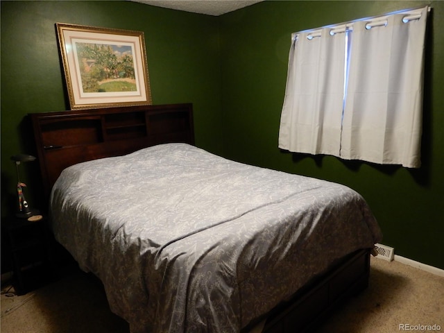 bedroom featuring carpet