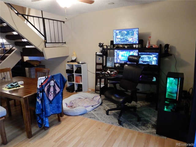 office featuring ceiling fan, wood-type flooring, and a textured ceiling