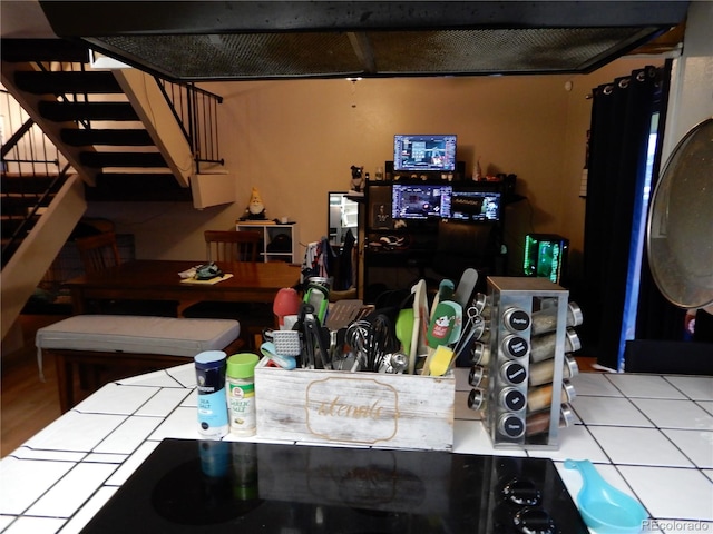 kitchen featuring tile counters and wood-type flooring