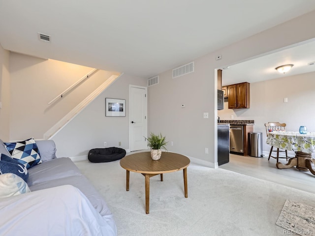 living room featuring light colored carpet