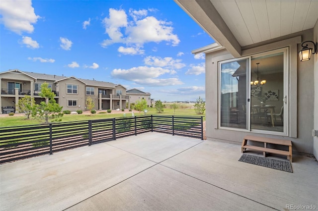 view of patio featuring a balcony