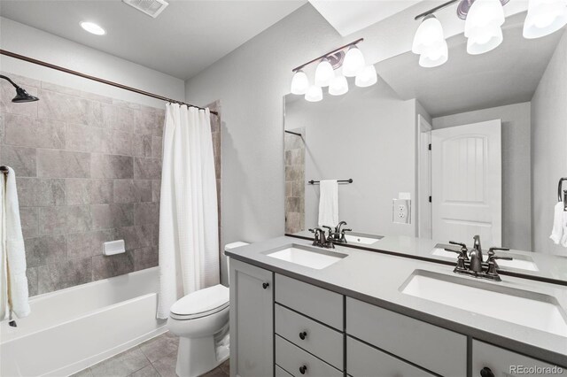 full bathroom with tile patterned flooring, vanity, toilet, and shower / tub combo with curtain