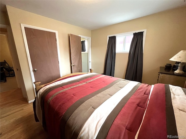 bedroom with wood finished floors