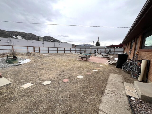 view of yard featuring a patio and a fenced backyard