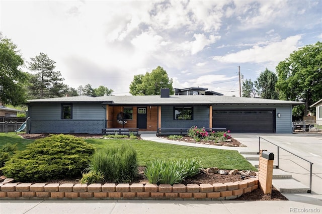 10250 W 33rd Ave, Wheat Ridge, CO 80033 - view of front of home with driveway, a garage, a porch, brick siding, and a front yard