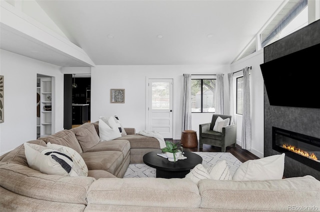 10250 W 33rd Ave, Wheat Ridge, CO 80033 - living area with vaulted ceiling, wood finished floors, and a large fireplace