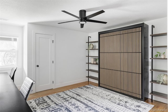10250 W 33rd Ave, Wheat Ridge, CO 80033 - bedroom with light wood-type flooring, a desk, and a ceiling fan