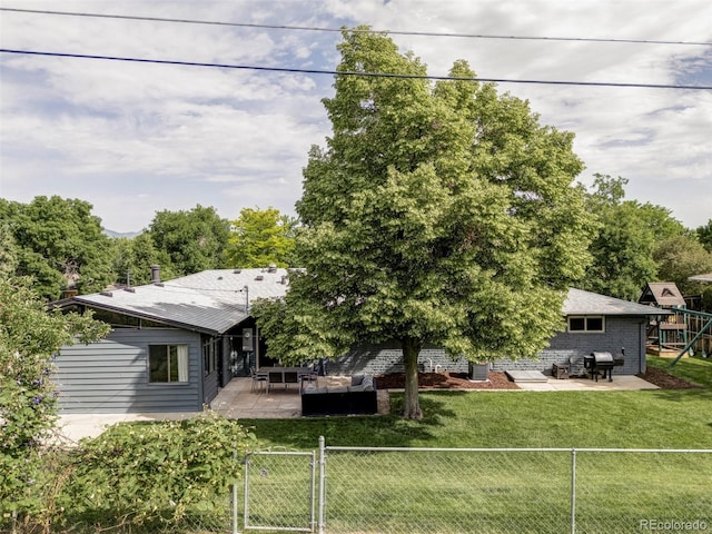 10250 W 33rd Ave, Wheat Ridge, CO 80033 - rear view of property featuring a patio area, a playground, and a gate