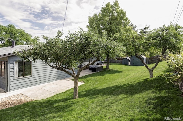 10250 W 33rd Ave, Wheat Ridge, CO 80033 - view of yard with a storage shed, a patio, and an outdoor hangout area
