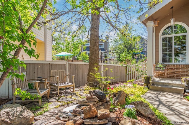 view of patio / terrace featuring fence