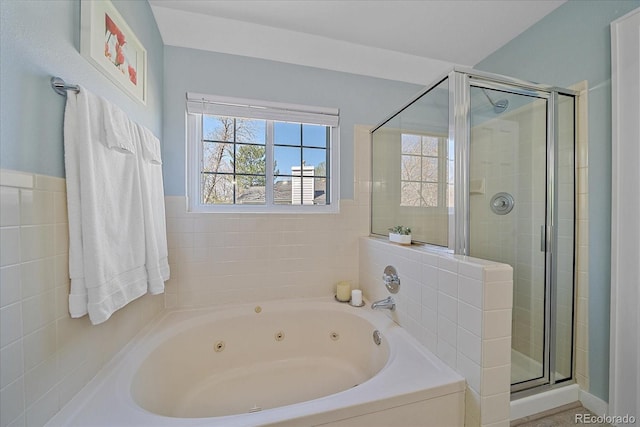 full bath featuring a shower stall and a whirlpool tub