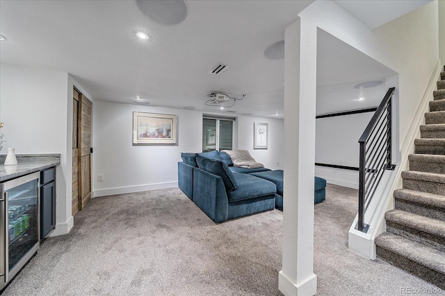 living room featuring wine cooler, light carpet, stairs, recessed lighting, and baseboards