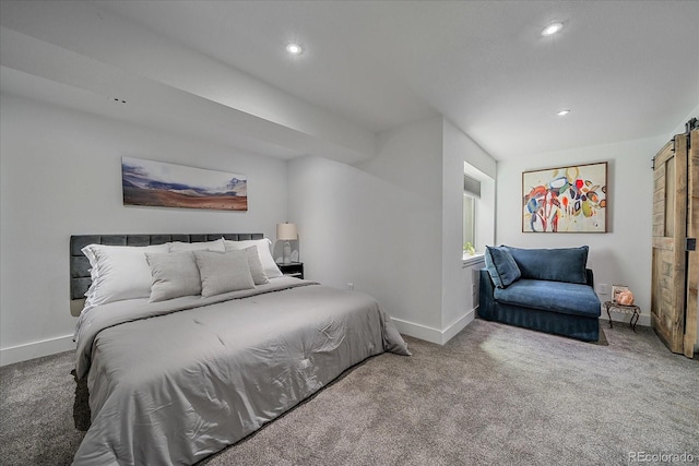 carpeted bedroom featuring a barn door, baseboards, and recessed lighting