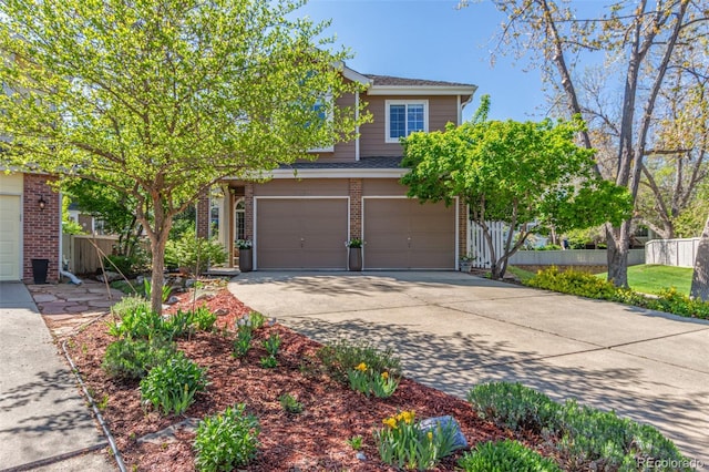 view of property hidden behind natural elements featuring brick siding, fence, and a garage