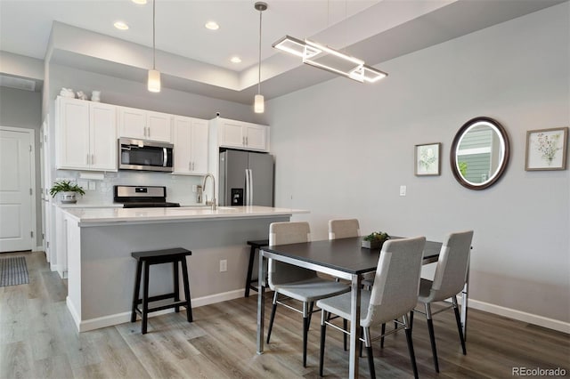 dining area featuring light hardwood / wood-style flooring