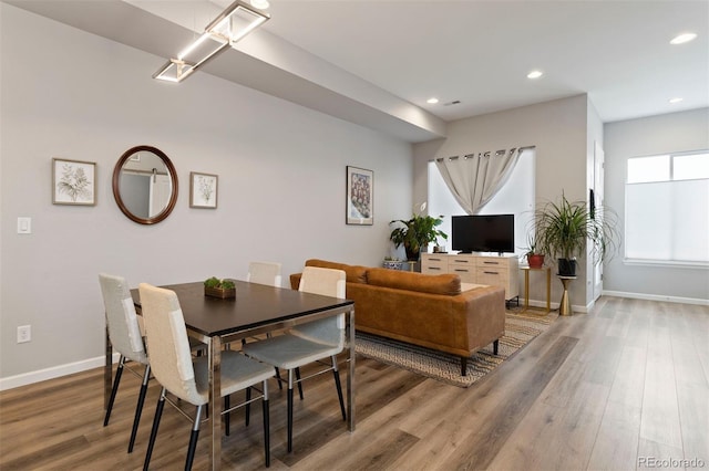 dining area featuring hardwood / wood-style flooring