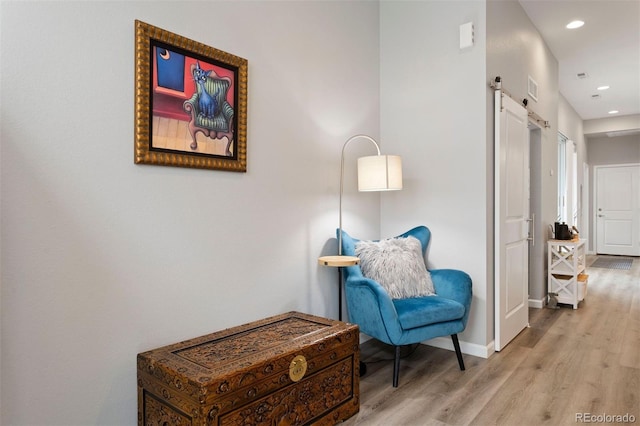 sitting room featuring light wood-type flooring