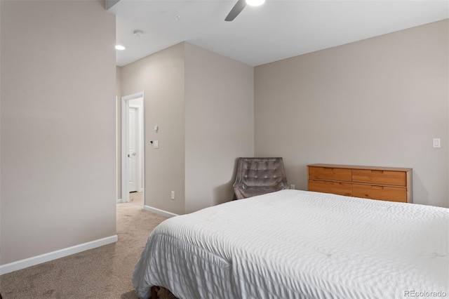 bedroom with ceiling fan and light colored carpet